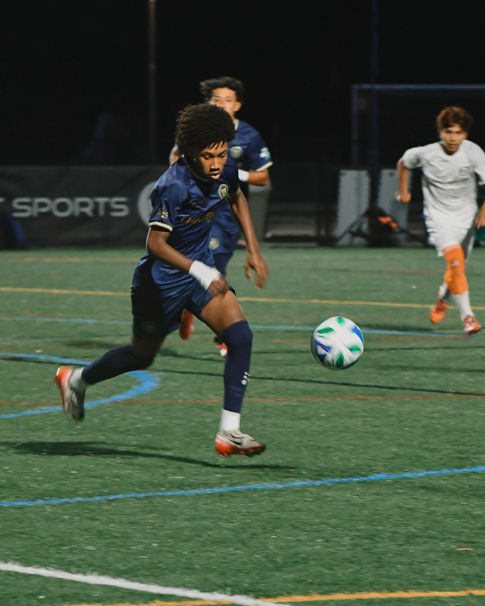 Player in action under floodlights